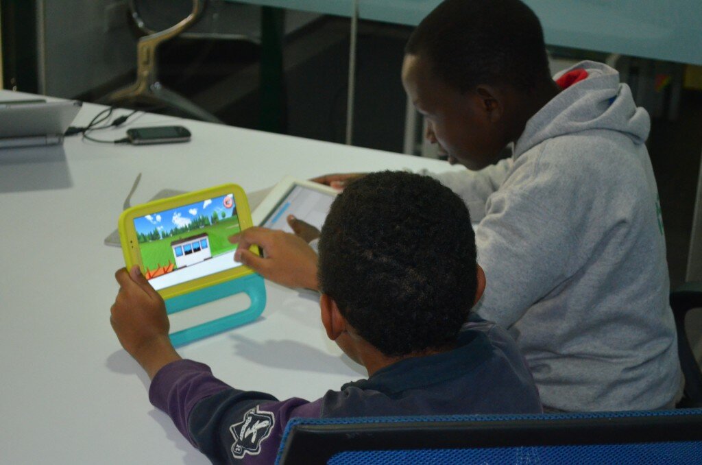Enock Liech and David Ochieng from Thika Road Christian testing the Samsung tablet before Wireless Wednesday for kids